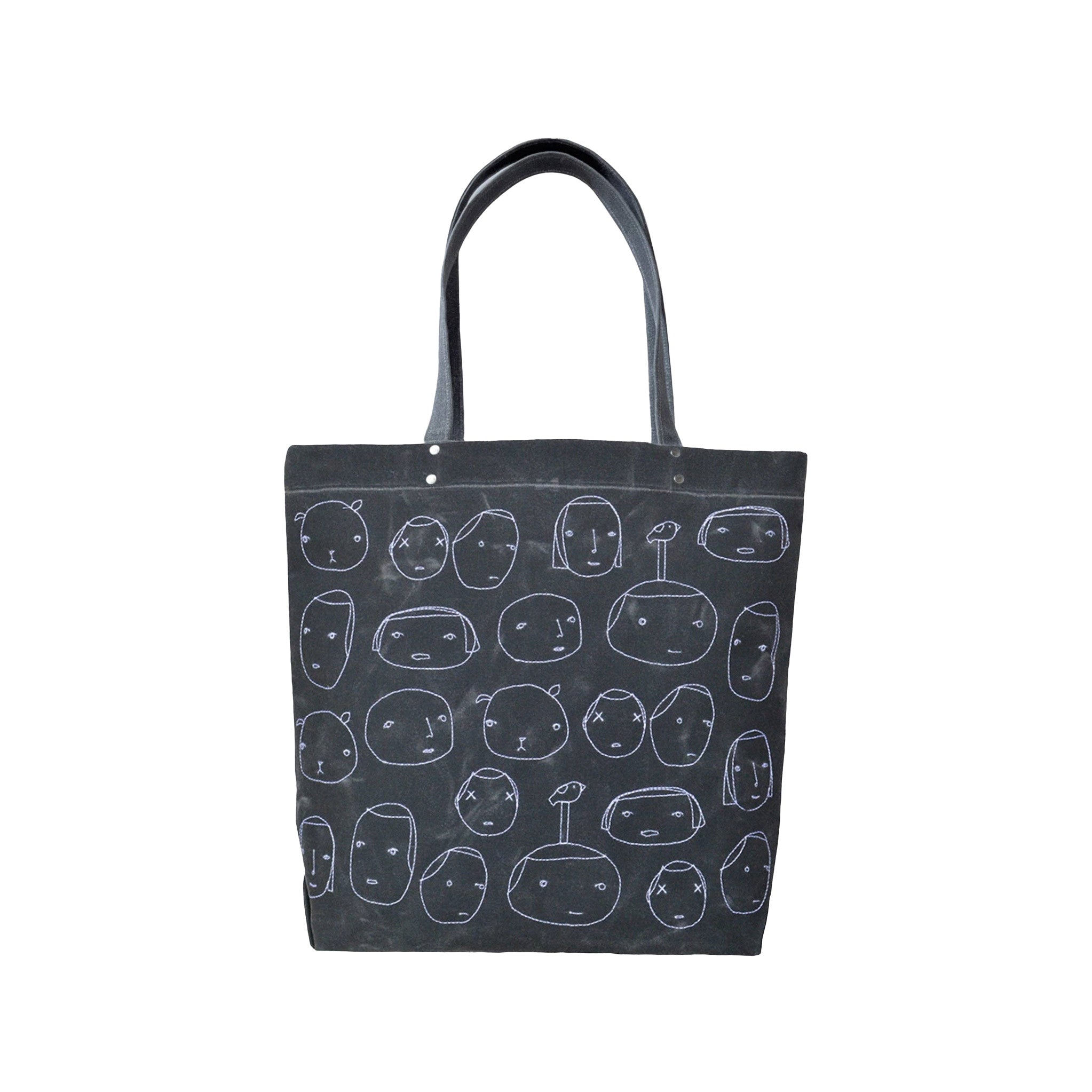 Everyday People Tote by K Studio in waxed canvas with stitched white faces, magnetic closure, and interior pocket—designed and handcrafted in Grand Rapids, Michigan.