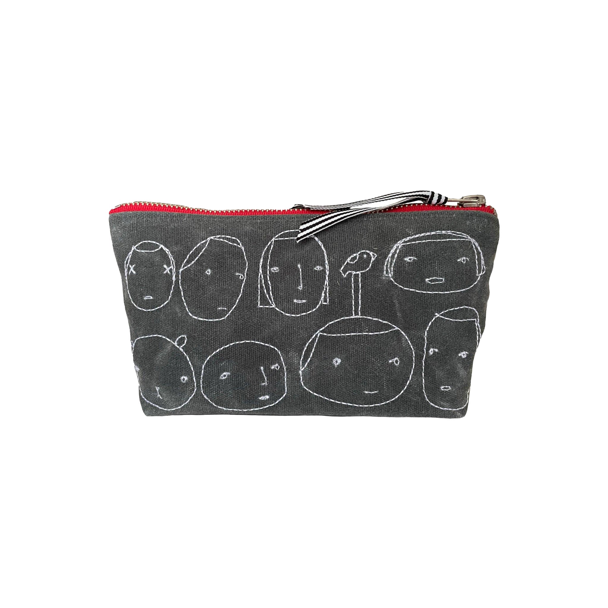 Grey waxed canvas pouch with stitched white faces, red zipper, and ribbon tab, Everyday People design by K Studio.