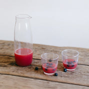 Kinto Unitea Cold Brew Carafe, 1100 ml clear glass carafe with mesh filter. Designed for cold brew tea, coffee, or fruit-infused water.