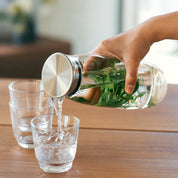 Kinto Unitea Cold Brew Carafe, 1100 ml clear glass carafe with mesh filter. Designed for cold brew tea, coffee, or fruit-infused water.