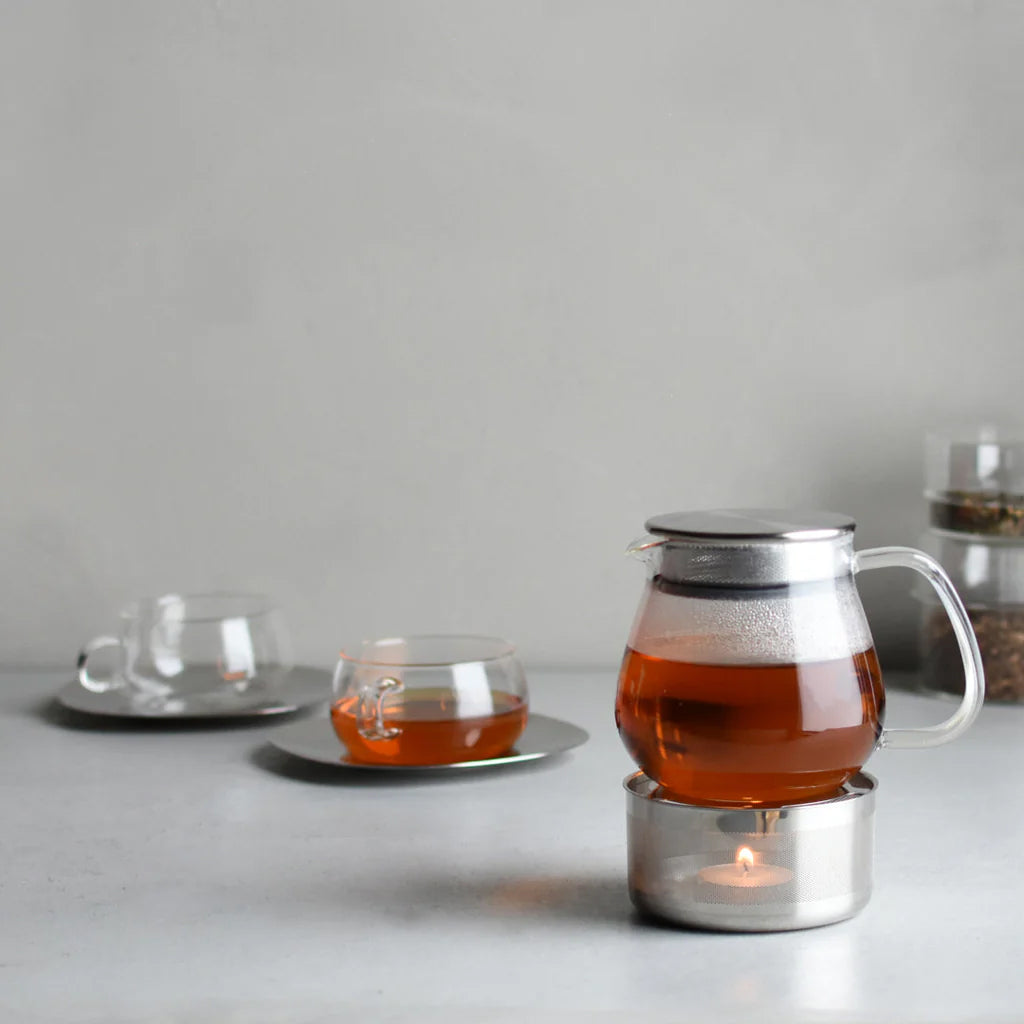 Kinto Unitea One Touch Teapot in clear glass with stainless steel strainer lid. Minimal Japanese teapot for loose leaf brewing.