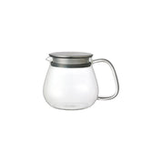 Kinto Unitea One Touch Teapot in clear glass with stainless steel strainer lid. Minimal Japanese teapot for loose leaf brewing.