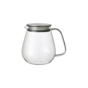 Kinto Unitea One Touch Teapot in clear glass with stainless steel strainer lid. Minimal Japanese teapot for loose leaf brewing.