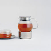 Kinto Unitea Teapot and Warmer Set in heat-resistant glass with stainless steel details. Japanese design for brewing and keeping tea hot with a tea light.