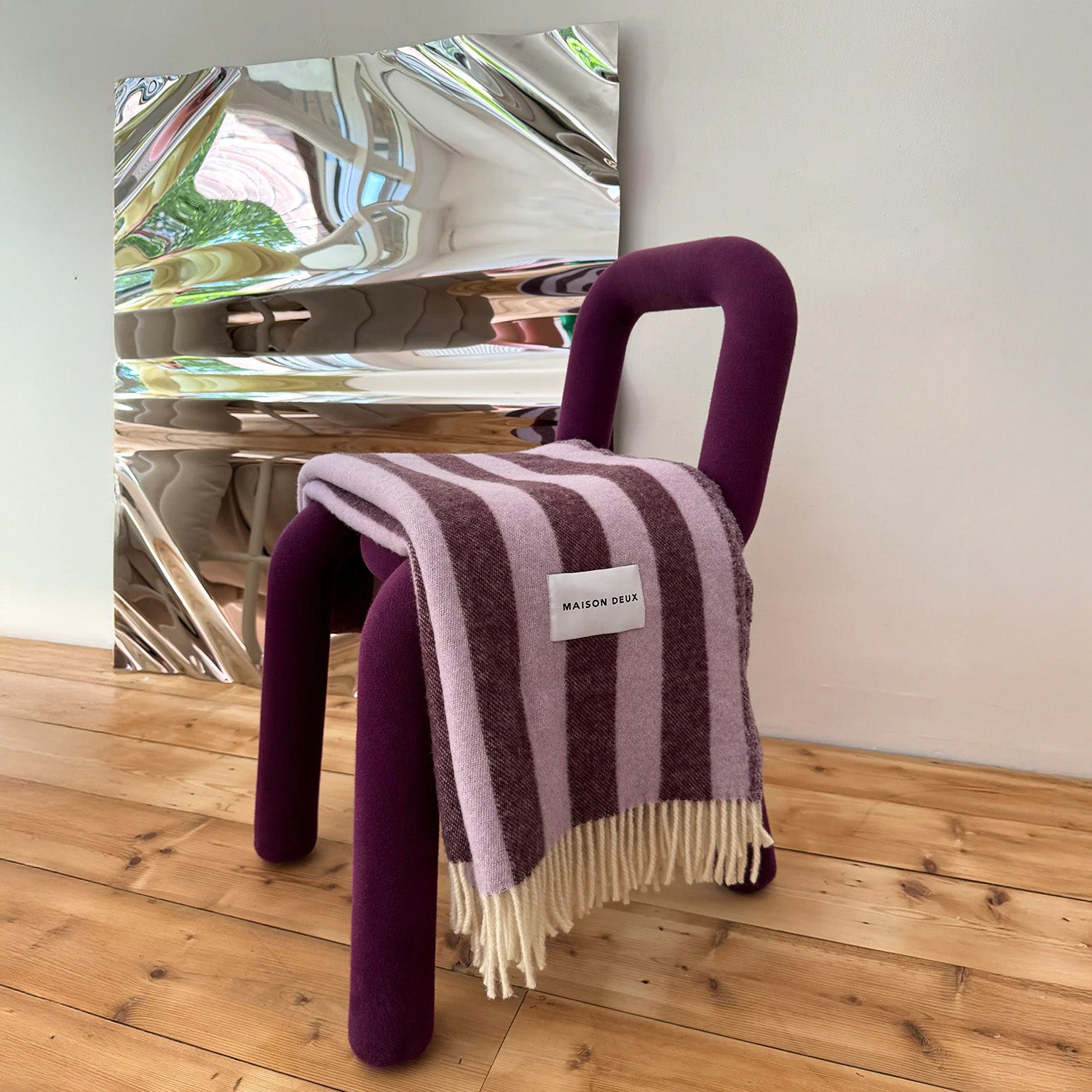 Maison Deux Candy Wrap Blanket in lilac and aubergine lambswool, cheeky reversible candy-stripe throw for sofa or bed.