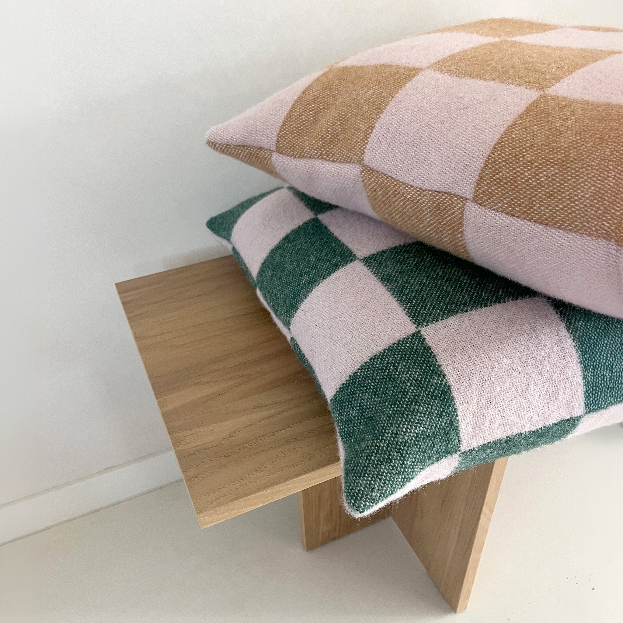 Maison Deux Checkerboard Cushion Cover in 100% wool, jacquard-woven with bold graphic checkerboard pattern.