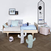 OYOY Cactus Cushion in pale mint cotton knit with black cactus print, soft pillow for kids’ or adults’ décor.