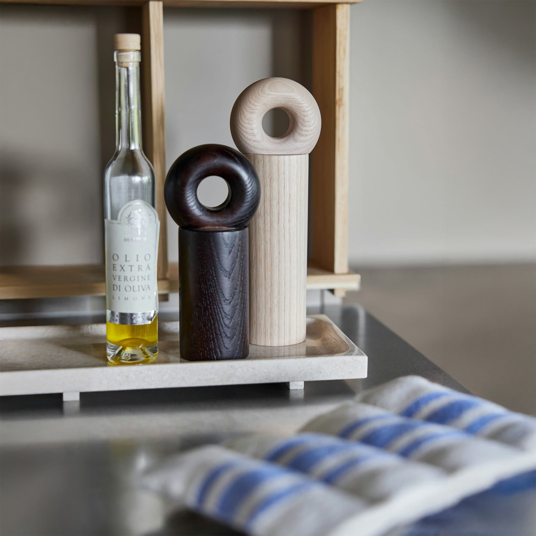 OYOY Living Design Hoop Mill Grinder in FSC-certified ash wood, available in Natural or Dark finish, two sizes. CrushGrind® mechanism for salt, pepper, or spices.