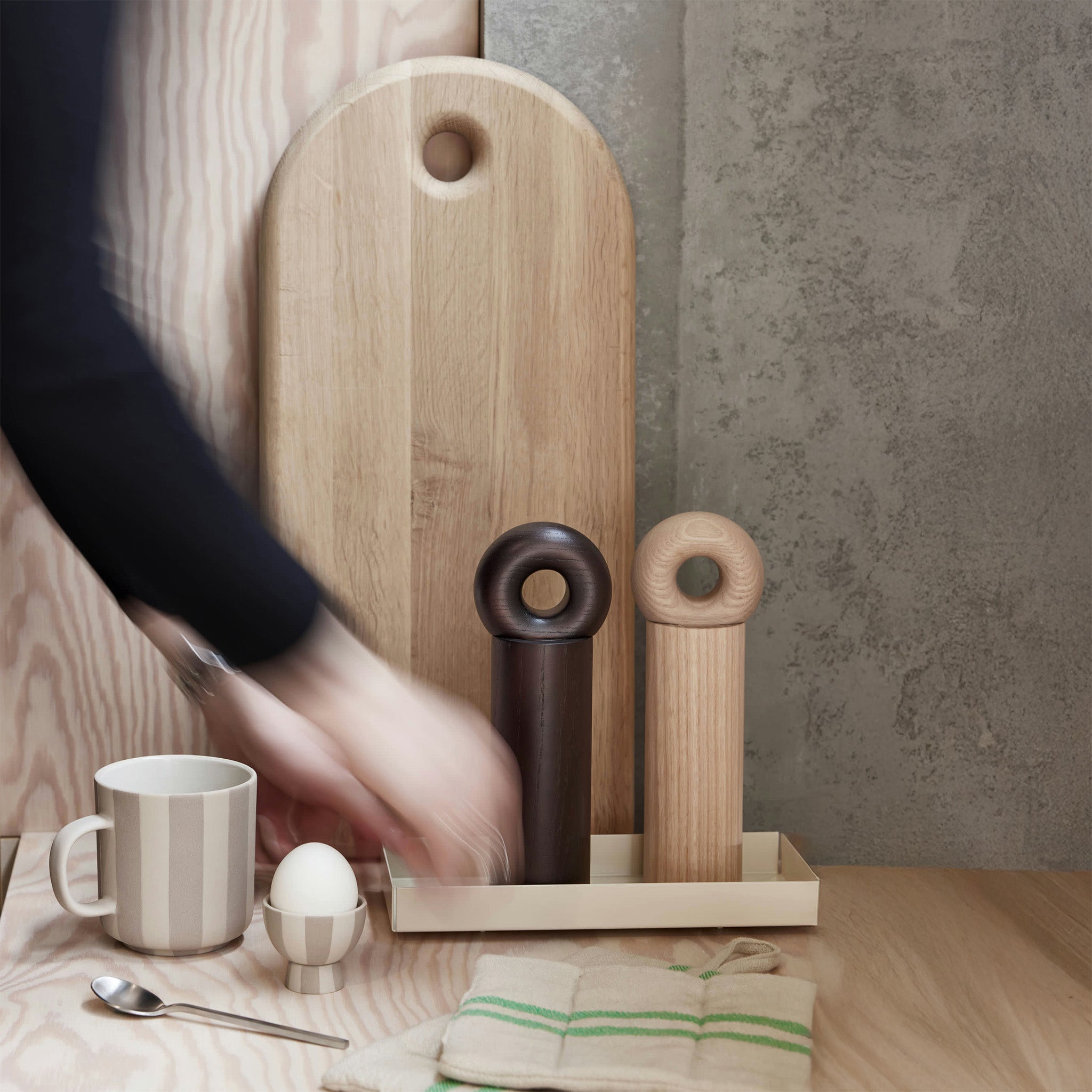 OYOY Living Design Hoop Mill Grinder in FSC-certified ash wood, available in Natural or Dark finish, two sizes. CrushGrind® mechanism for salt, pepper, or spices.