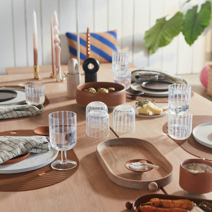 OYOY Living Design Hoop Mill Grinder in FSC-certified ash wood, available in Natural or Dark finish, two sizes. CrushGrind® mechanism for salt, pepper, or spices. OYOY Living Design Inka Wood Tray in natural oak, oval and round shapes. Designed in Denmark with organic curved silhouette.