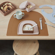 OYOY Rainbow Snack Bowl with Lid in dusty blue silicone, embossed rainbow design, dishwasher and microwave safe.