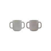 OYOY Kappu Cup set of 2 in clay and pale mint, two-handled silicone cups with embossed mushroom and rainbow designs.