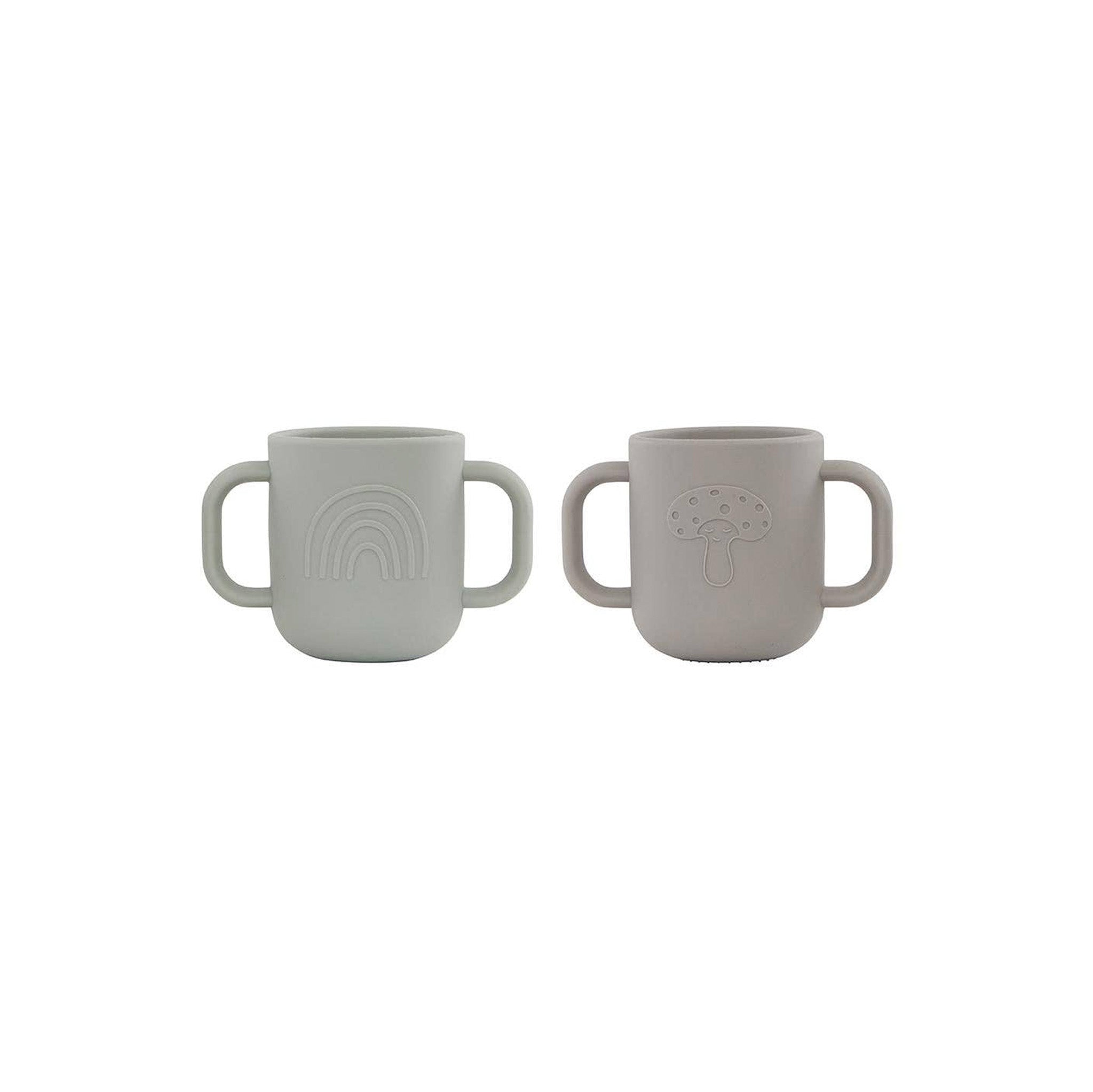 OYOY Kappu Cup set of 2 in clay and pale mint, two-handled silicone cups with embossed mushroom and rainbow designs.