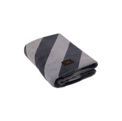 OYOY Kaya Dog Blanket, medium size, black with bold stripes, soft fleece for cozy pets.