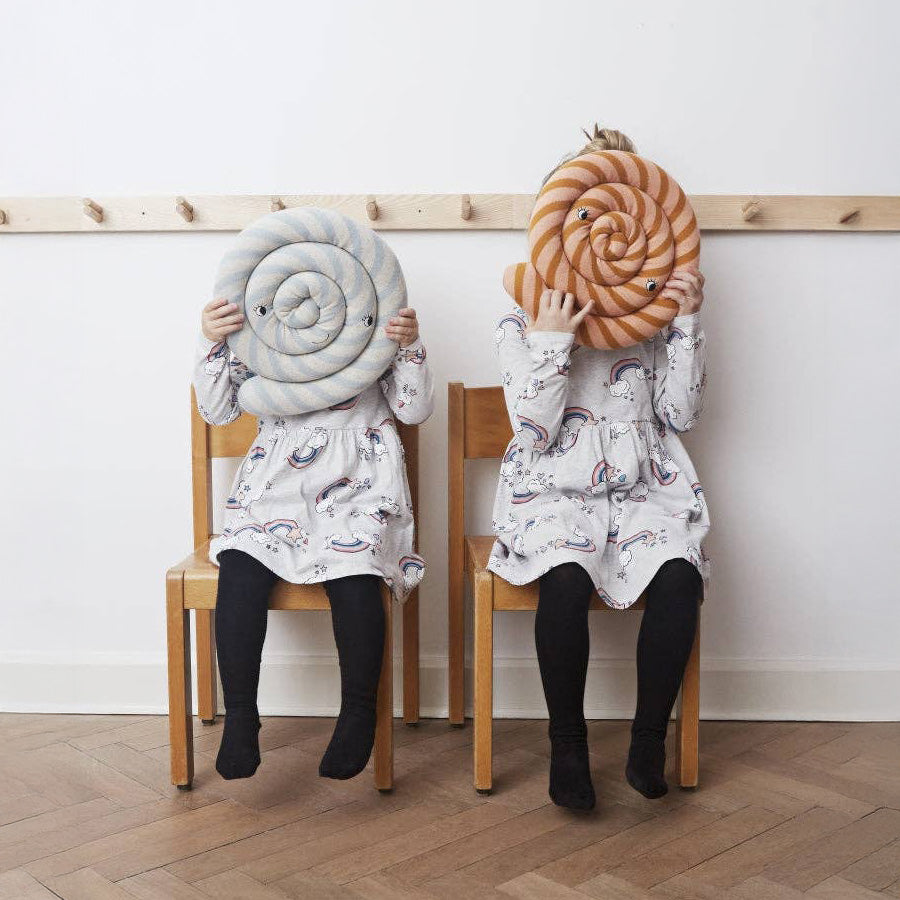 OYOY Lollipop Cushions in blue and caramel striped cotton knit with soft filling, candy-shaped pillow for kids’ or adults’ décor.