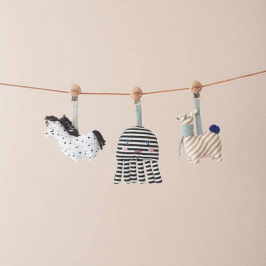 OYOY Octopus Baby Carrier Clip in organic cotton, black-and-white striped octopus with embroidered face and wooden logo clip.