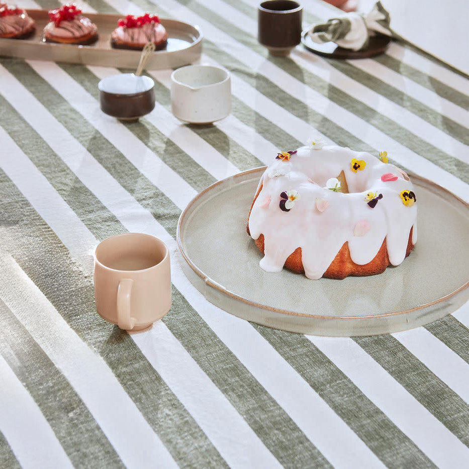 OYOY Living Design Striped Tablecloth in organic cotton with bold striped pattern. Available in multiple colors and sizes (200 × 140 cm or 260 × 140 cm).