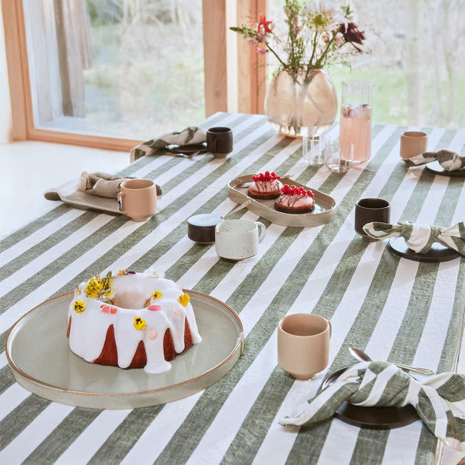 OYOY Living Design Striped Tablecloth in organic cotton with bold striped pattern. Available in multiple colors and sizes (200 × 140 cm or 260 × 140 cm).