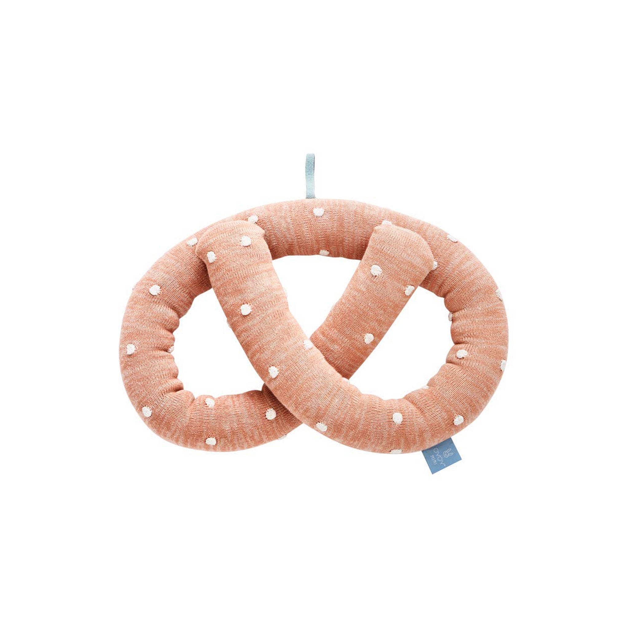 OYOY Sweet Pretzel Cushion in caramel cotton knit with dotted design, cuddly pretzel pillow for kids or adults.