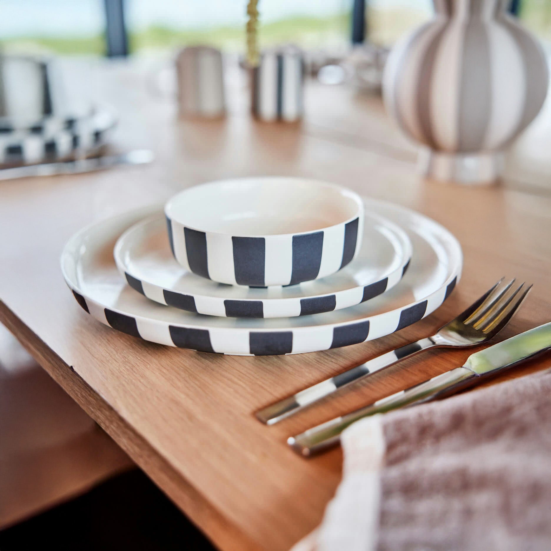 Toppu Bowl in striped stoneware by OYOY Living Design. Handmade, hand-painted, dishwasher and microwave safe. Available in two sizes.