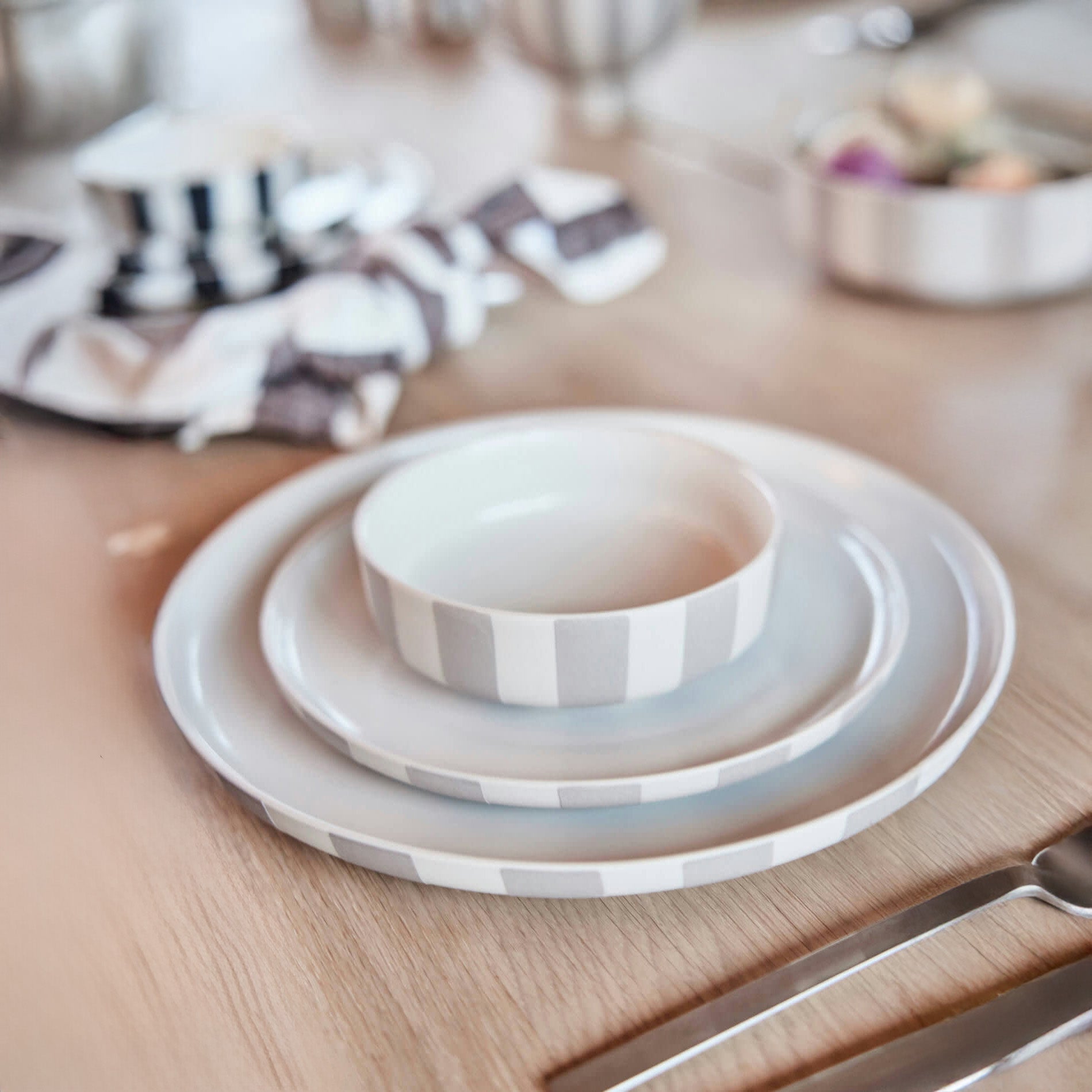 Toppu Bowl in striped stoneware by OYOY Living Design. Handmade, hand-painted, dishwasher and microwave safe. Available in two sizes.