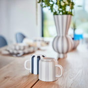 Toppu Mug by OYOY Living Design in hand-painted stoneware stripes, handmade and dishwasher safe, available in multiple colors.