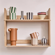 Toppu Mug by OYOY Living Design in hand-painted stoneware stripes, handmade and dishwasher safe, available in multiple colors.