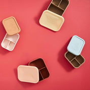 OYOY Yummy Lunch Box in silicone with Yummy print, three compartments for snacks and lunches.