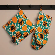 RATIA Esikko Potholder and Oven Mitt in Green and Yellow floral print, cotton with padded polyester fill. Made in Portugal.