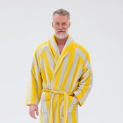 RATIA Unisex Striped Bathrobe in warm yellow/light grey terry cotton blend with belt, raglan sleeves, and pockets. Scandinavian unisex bathrobe, available in S/M and L/XL, made in Portugal.