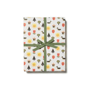 Red Cap Cards For You Gift Wrap, illustrated by Jon Klassen. Gift wrap with quirky trees, flowers, and balloons with eyes. Recycled paper, set of 3 rolled sheets, 19 × 27 inches.