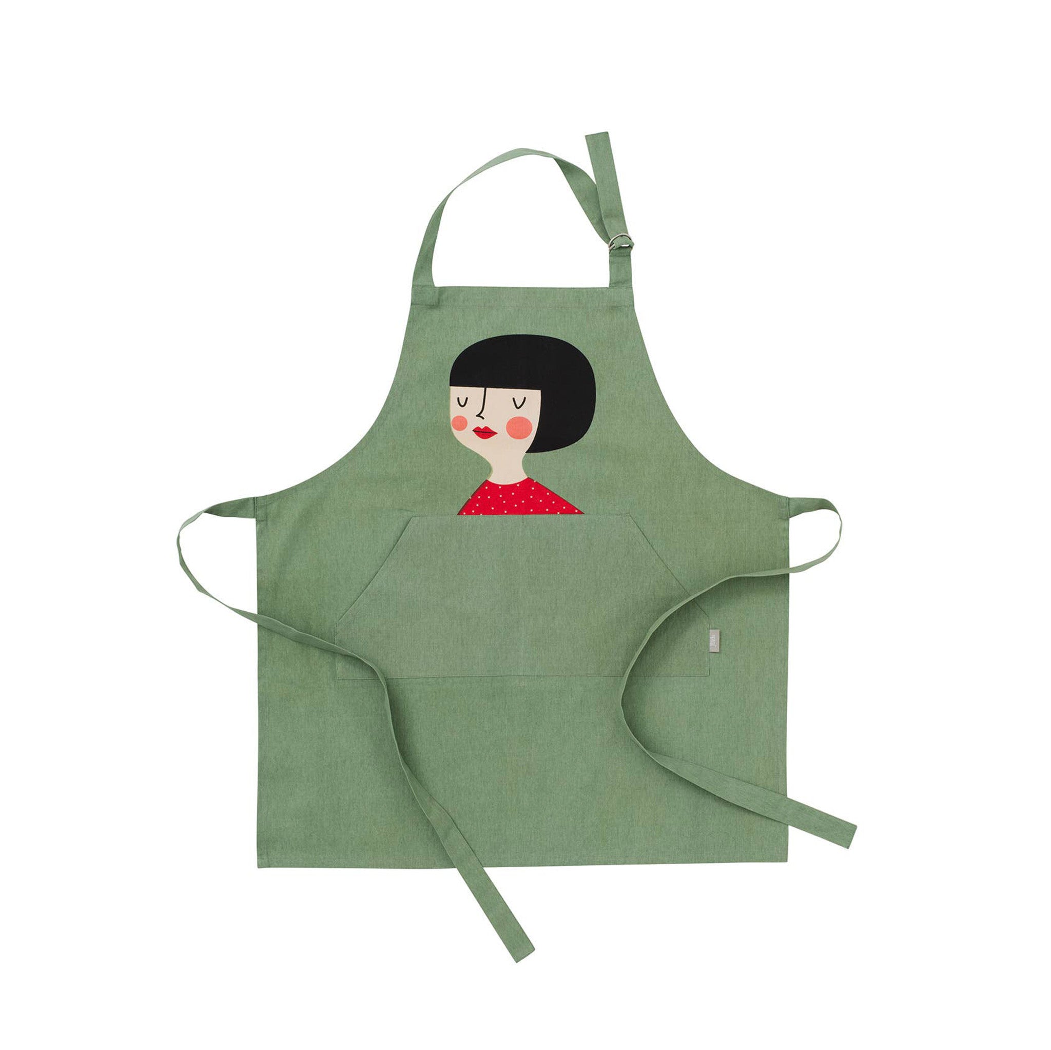 Kerstin Kompisförkläde Apron by Spira of Sweden. Hand-printed cotton apron featuring Kerstin, the dahlia-dreaming flower lover. Gift-boxed, machine washable, OEKO-TEX® certified, 29.5" × 32.5", made in Sweden.