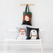 Kompiskudde Luke Cushion Cover by Spira of Sweden, natural cotton pillow cover with illustrated Luke character, 20" × 20".