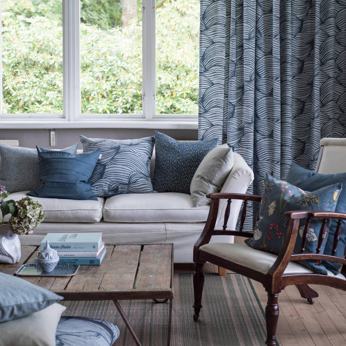 Wave Cushion Cover by Spira of Sweden, cotton pillow cover with Nordic wave print inspired by ocean tides, double-sided in blue or grey, 20" × 20".