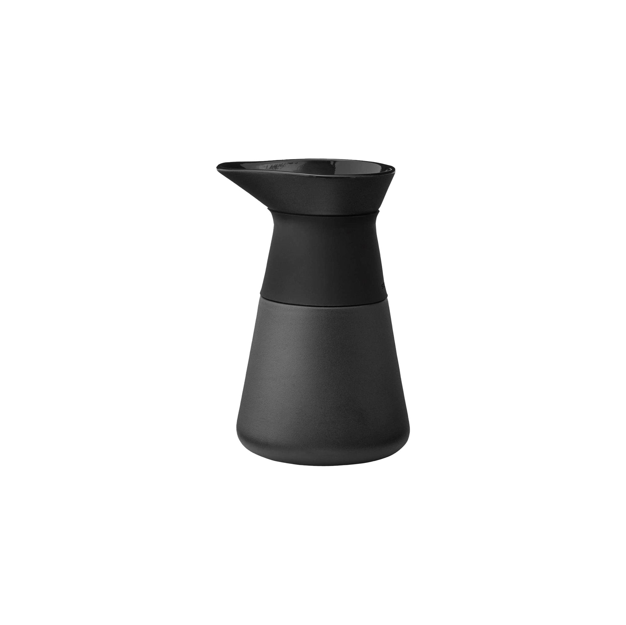 Stelton Theo Milk Jug in matte black stoneware with glossy interior and silicone collar, designed by Francis Cayouette. Rustic yet modern Nordic jug, 0.4 L.