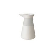 Stelton Theo Milk Jug in matte sand stoneware with glossy interior and silicone collar, designed by Francis Cayouette. Rustic yet modern Nordic jug, 0.4 L.