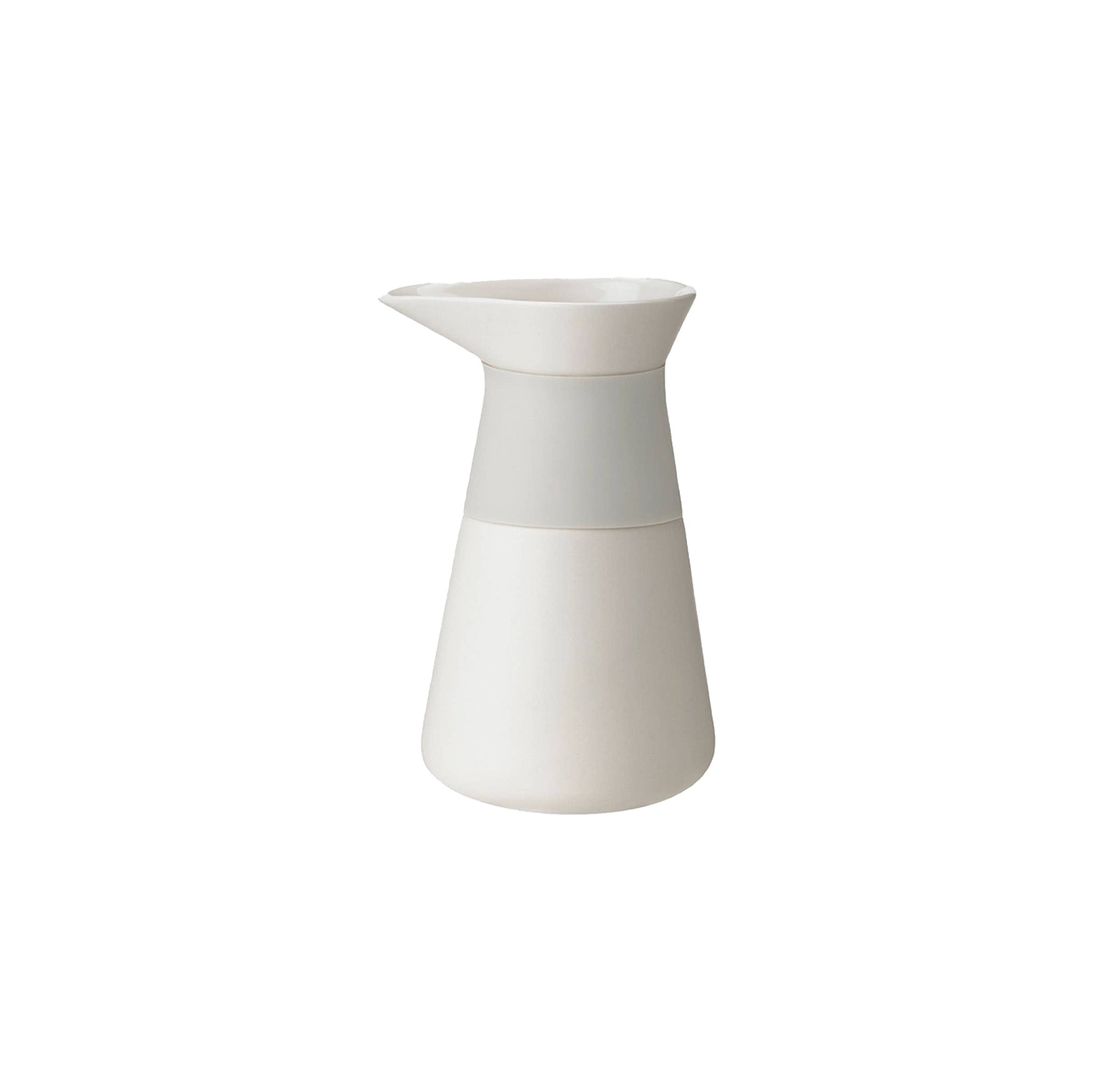 Stelton Theo Milk Jug in matte sand stoneware with glossy interior and silicone collar, designed by Francis Cayouette. Rustic yet modern Nordic jug, 0.4 L.