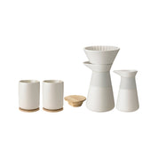 Stelton Theo Slow Brew Coffee Bundle in matte black or sand stoneware with glossy interiors. Includes Slow Brew Coffee Maker, Milk Jug, and two Thermo Cups with bamboo coasters. Designed by Francis Cayouette.