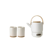 Stelton Theo Teapot Bundle in matte sand stoneware with glossy interiors. Includes Teapot, Tea Warmer, and two Thermo Cups with bamboo coasters. Designed by Francis Cayouette. Pairs with Theo Milk Jug.