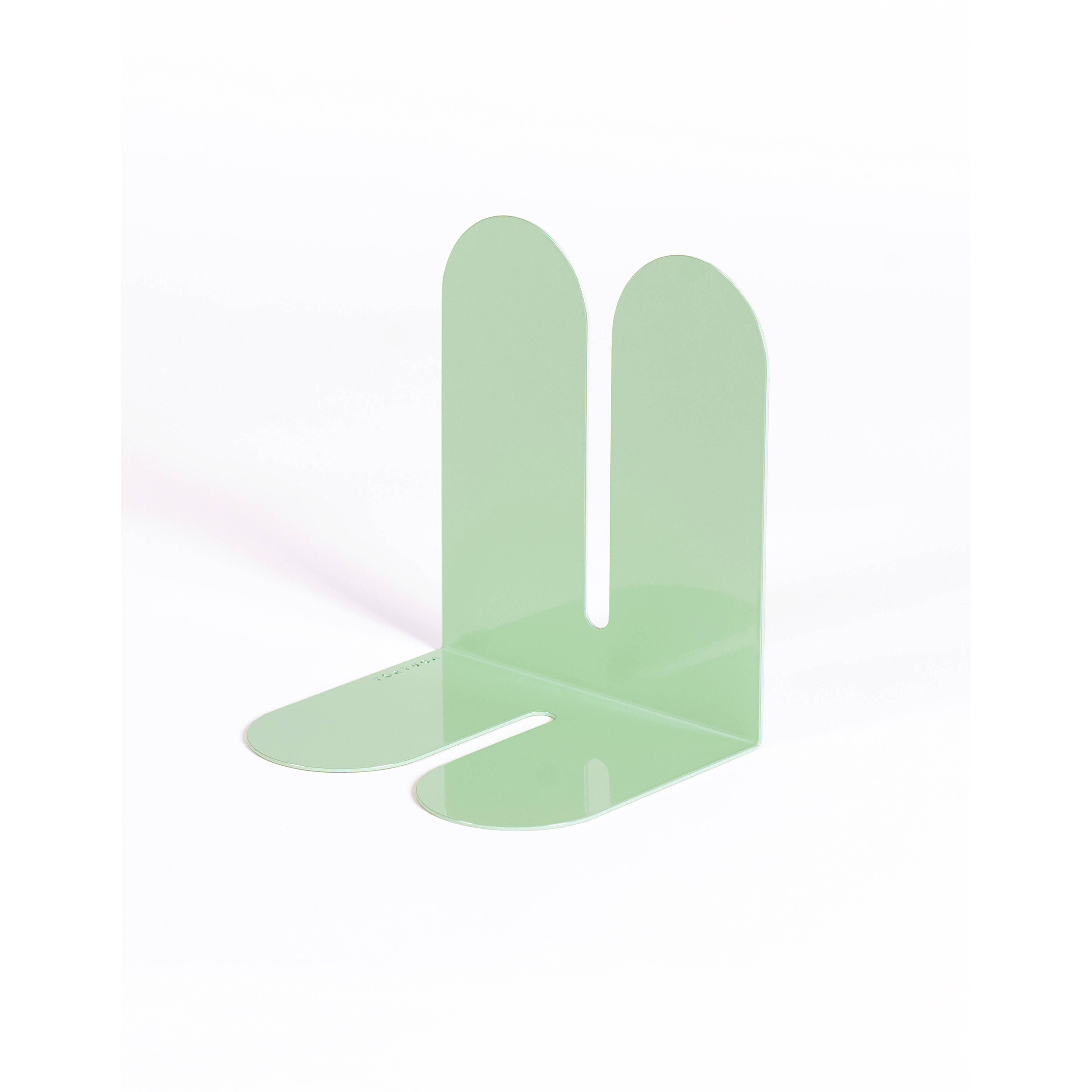 Tortuga Forma Large Bookend in cactus green solid steel, oversized arc design for supporting art books, cookbooks, or vinyl.