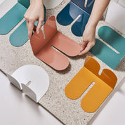 Tortuga Forma Bookends, solid steel arc design for holding cookbooks, magazines, and novels.