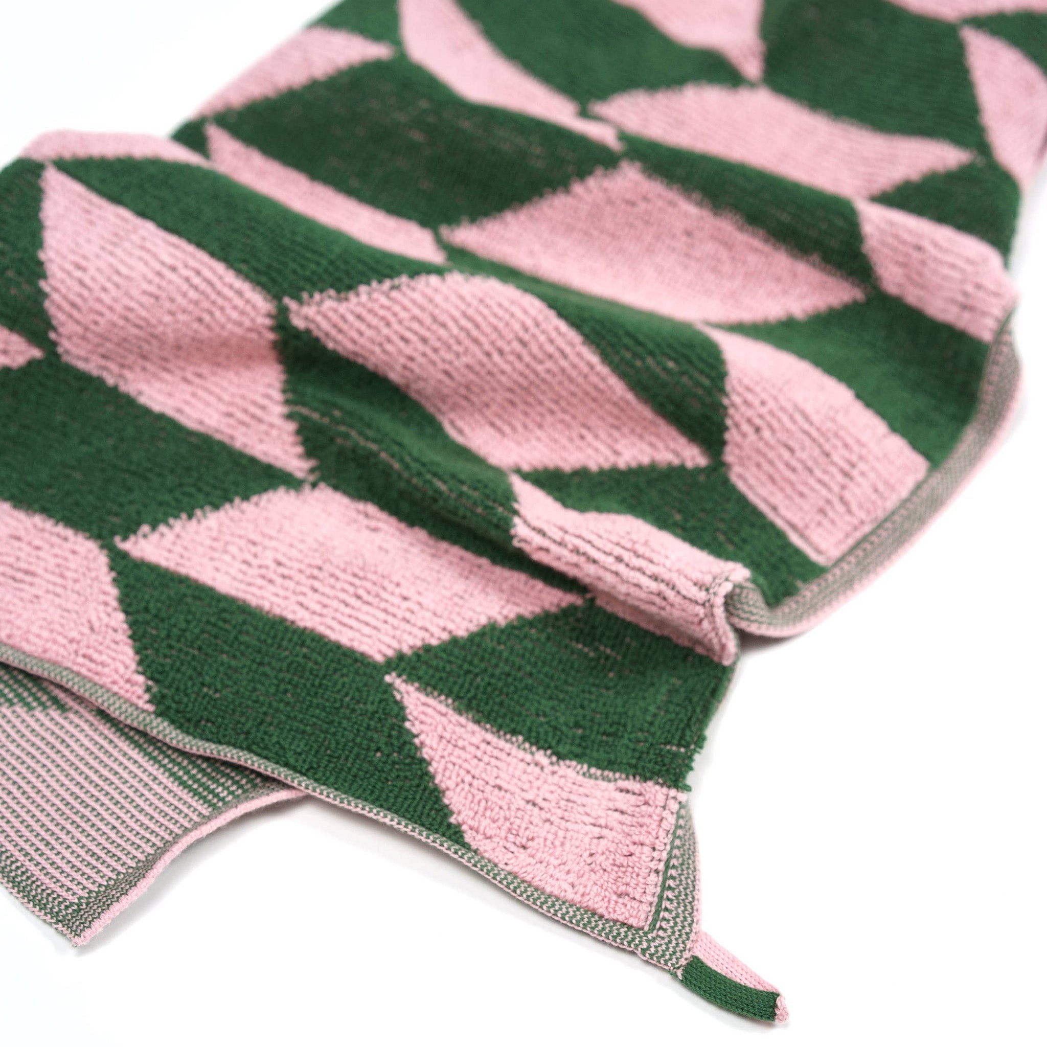 Towel Studio Arrow Tail Guest Towel in Pink and Green, 50 × 50 cm with terry front and knit back.