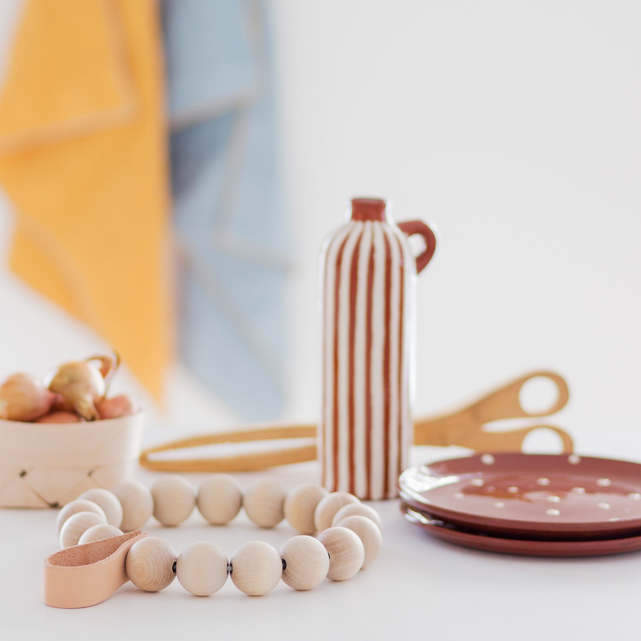 Verso Design KRANSSI Wreath Trivet in Birch with Leather loop, handcrafted Nordic bead design, usable as wreath or trivet.