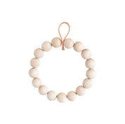 Verso Design KRANSSI Wreath Trivet in Birch with Leather loop, handcrafted Nordic bead design, usable as wreath or trivet.