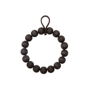 Verso Design KRANSSI Wreath Trivet in Black with Grey Felt loop, handcrafted Nordic bead design, usable as wreath or trivet.