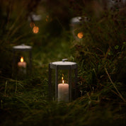 Firefly Lantern in powder-coated steel with glass sides and silicone strap by Zone Denmark. Available in two sizes: 25 cm and 35 cm.