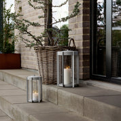 Firefly Lantern in powder-coated steel with glass sides and silicone strap by Zone Denmark. Available in two sizes: 25 cm and 35 cm.